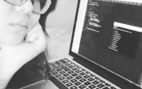 Catzie coding the Tiny Cakery website